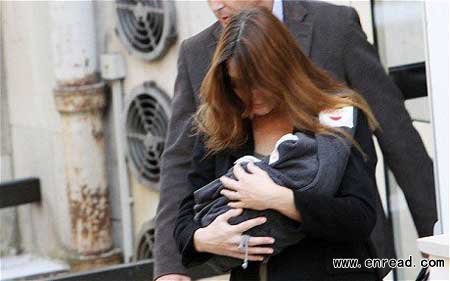 Cradled by her former-supermodel mother and surrounded by bodyguards, the most famous baby in France made her first public appearance today.