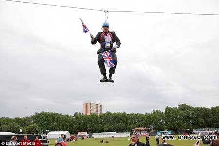 Johnson has been caught on video by a UK newspaper hanging 20 metres above the ground after getting stuck on a zip-wire in a park near the Olympic precinct.