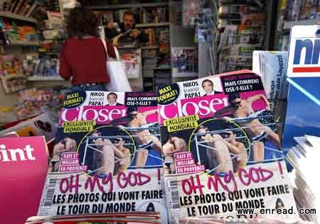 Copies of French magazine Closer showing pictures of Catherine, Duchess of Cambridge, and Britain's Prince William are displayed in a newspaper kiosk in Nice, September 14, 2012.