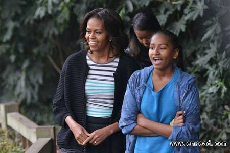 First Lady Michelle Obama and her daughters react to seeing Giant Pandas at the Giant Panda Research Base in Chengdu in southwest China’s Sichuan province March 26, 2014.