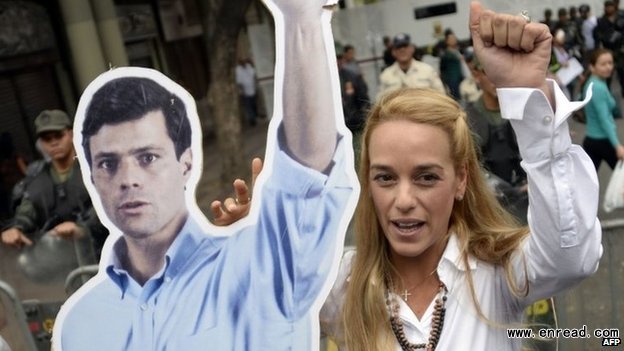 Lilian Tintori holds a poster of her her husband, who has been in <a href=