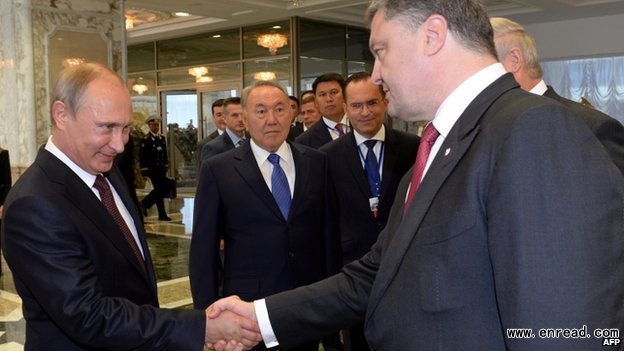 Vladimir Putin, left, and Petro Poroshenko shook hands at the start of the summit