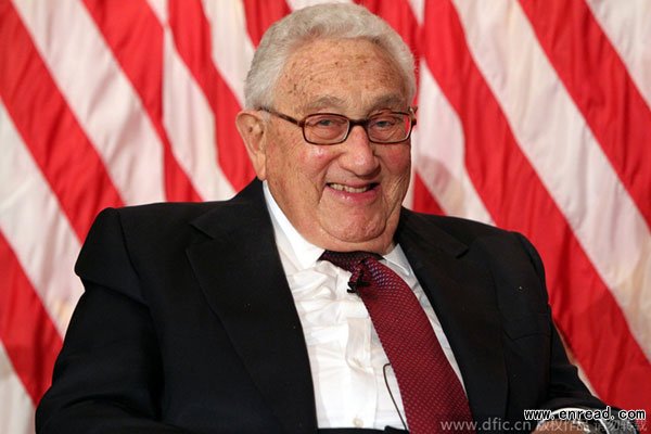 Former Secretary of State Henry Kissinger discusses with former Nixon aide Frank Gannon.