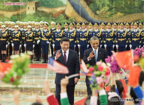 Chinese President Xi Jinping (L Front) holds a welcoming ceremony for U.S. President Barack Obama (R Front) at the Great Hall of the People in Beijing, capital of China, Nov. 12, 2014.