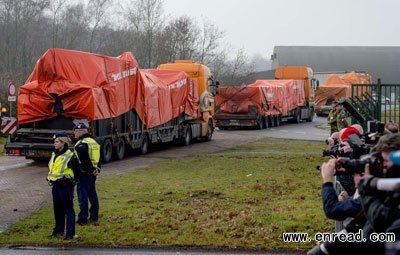 Lorries carrying the wreckage of the passenger airplane MH17 that crashed in Ukraine arrive at Gilze-Rijen airbase in Gilze-Rijen, The Netherlands, on December 9, 2014.
