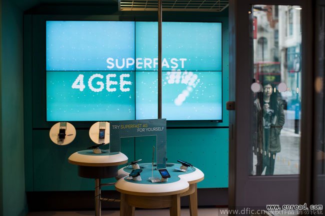 Mobile 4G devices are displayed in front of a bank of large screens in an Everything Everywhere (EE) store on <a href=