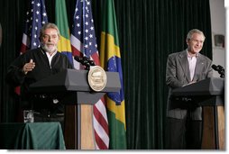 President George W. Bush listens as Brazilian President Luiz Inacio Lula da Silva answers a reporters question during their joint news conference Saturday, March 31, 2007, at Camp David.  White House photo by Eric Draper