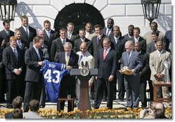 President George W. Bush is embraced by Indianapolis Colts quarterback Peyton Manning, left, and coach Tony Dungy during a ceremony honoring their victory in the 2007 NFL Super Bowl Monday, April 23, 2007, on the South Lawn. White House photo by Shealah Craighead