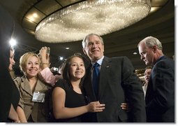 President George W. Bush greets audience members after addressing the National Hispanic Prayer Breakfast Friday, June 15, 2007, in Washington, D.C. Our nation is more hopeful because of the Hispanic Americans who serve in the armies of compassion, who are surrounding neighbors in need who hurt with love; people who are helping to change America one heart and one soul and one conscience at a time, said the President in his remarks. White House photo by Joyce N. Boghosian
