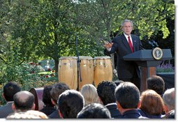 President George W. Bush delivers remarks during a celebration of Hispanic Heritage Month Wednesday, Oct. 10, 2007, in the Rose Garden. Hispanic Americans strengthen our nation with their commitments to familia y fe (family and faith), said the President. Hispanic Americans enrich our country with their talents and creativity and hard work. Hispanic Americans are living the dream that has drawn millions to our shores -- and we must ensure that the American Dream remains available for all. White House photo by Grant Miller