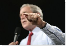 President George W. Bush gestures to make a point during his remarks to an audience at the John Q. Hammons Convention Center in Rogers, Ark., Monday, Oct. 15, 2007, urging Congress to be fiscally responsible with the taxpayers money. White House photo by Eric Draper