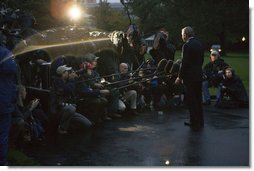 President George W. Bush stands in the early morning rain on the South Lawn Thursday, Oct. 25, 2007, as he talks to the media before departing for California where he is scheduled to view firsthand the devastation caused by the recent wildfires. Said the President, "I will assure the people of California that the federal government will be deploying resources, assets and manpower necessary to help fight these fires." White House photo by Chris Greenberg