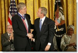 President George W. Bush awards the Presidential Medal of Freedom to physician Francis S. Collins, director of the National Human Genome Research Institute, in the East Room Nov. 5, 2007. White House photo by Eric Draper