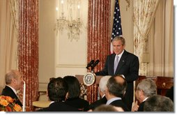 President George W. Bush addresses his remarks at the Secretary of States Dinner Monday evening, Nov. 26, 2007 at the State Department in Washington, D.C., welcoming the participants attending the Annapolis Conference. White House photo by Chris Greenberg