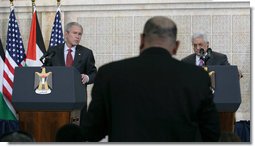 President George W. Bush and President Mahmoud Abbas of the Palestinian Authority, listen to a reporters question Thursday, Jan. 10, 2008, during a joint press availability at in Ramallah. White House photo by Chris Greenberg