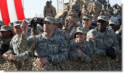 Members of the military line the path to the stage as President George W. Bush appeared Saturday, Jan. 12, 2008, at Camp Arifjan, Kuwait. An estimated 4,000 troops heard the President say "History will say, it was when you were called upon, you served, and the service you rendered was absolutely necessary to defeat an enemy overseas so we do not have to face them here at home." White House photo by Eric Draper