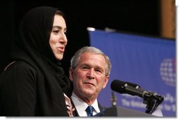 President George W. Bush is introduced Sunday, Jan. 13, 2008, by Aida Abdullah Al-Azdi, Executive Director, Emirates Center for Strategic Studies Research, before his speech at the Emirates Palace Hotel in Abu Dhabi. White House photo by Eric Draper