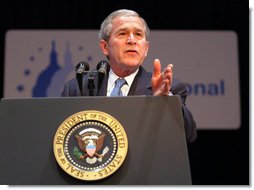 President George W. Bush gestures as he addresses his remarks at the 2008 "Congress of Tomorrow" Luncheon Friday, Jan. 25, 2008, in White Sulphur Springs, West Virginia. President Bush urged the Senate to move quickly on the stimulus package to help rejuvenate the economy. White House photo by Chris Greenberg