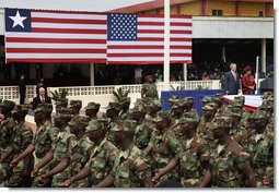 President George W. Bush and Liberian President Ellen Johnson Sirleaf review Liberian troops Thursday, Feb. 21, 2008, during President Bushs visit to the Barclay Training Center in Monvoria, Liberia. White House photo by Shealah Craighead