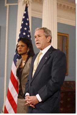 President George W. Bush stands with U.S. Secretary of State Condoleezza Rice as he talks with reporters Monday, March 24, 2008, following a briefing at the U.S. Department of State in Washington, D.C. White House photo by Eric Draper