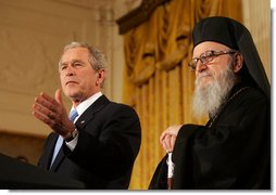 President George W. Bush is joined by Archbishop Demetrios as he delivers his remarks at the Celebration of Greek Independence Day Tuesday, March 25, 2008, in the East Room of the White House. White House photo by Joyce N. Boghosian