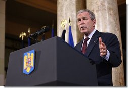 President George W. Bush emphasizes a point as he delivers remarks Tuesday, April 2, 2008, at the National Bank of Savings in Bucharest. White House photo by Shealah Craighead