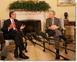 President George W. Bush listens to remarks by President Alvaro Colom Monday, April 28, 2008, in the Oval Office during a visit the Guatemalan leader and his wife to the White House. White House photo by Chris Greenberg