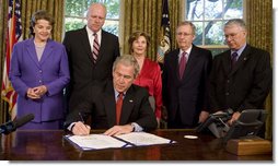 President George W. Bush signs H.R. 4286, Congressional Gold Medal: Daw Aung San Suu Kyi, during a ceremony Tuesday, May 6, 2008, in the Oval Office. The bill awards a congressional gold medal to the Nobel Laureate for her courageous and unwavering commitment to peace, nonviolence, human rights and democracy in Burma. Joining him for the signing are Mrs. Laura Bush, Senator Dianne Feinstein, (D-CA.); Congressman Joe Crowley of New York; Senator Mitch McConnell, (R-KY), and Congressman Don Manzullo of Illinois. White House photo by Joyce N. Boghosian