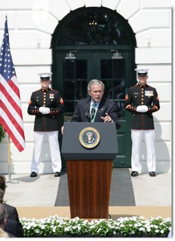 President George W. Bush gestures as he addresses his remarks highlighting the achievements of the USA Freedom Corps and honoring volunteerism Monday, Sept. 8, 2008, on the South Lawn of the White House. White House photo by Eric Draper