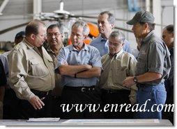 President George W. Bush meets with locals officials at the U.S. Coast Guard facility at Ellington Field in Houston Tuesday, Sept. 16, 2008 before taking an aerial tour of Texas areas damaged in last weekend's hurricane. Said the President afterward, "My first observation is that the state government and local folks are working very closely and working hard and have put a good response together. The evacuation plan was excellent in its planning and in execution. The rescue plan was very bold, and we owe a debt of gratitude to those who were on the front line pulling people out of harm's way, like the Coast Guard people behind us here."  White House photo by Eric Draper