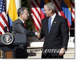 President George W. Bush shakes hands with Colombian President Alvaro Uribe following a joint press availability Saturday, Sept. 20, 2008, in the Rose Garden at the White House.  White House photo by Eric Draper