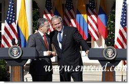 President George W. Bush talks with Colombian President Alvaro Uribe following a joint press availability Saturday, Sept. 20, 2008, in the Rose Garden at the White House.  White House photo by Eric Draper