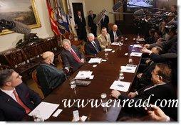 President George W. Bush thanks President Hamid Karzai of Afghanistan for his participation in a video teleconference with U.S. Provincial Reconstruction team leaders, National Guard Agriculture Development team representatives and Afghan governors Friday, Sept. 26, 2008, in the Roosevelt Room at the White House. U.S. Secretary of Defense Robert Gates, Chairman of the Joints Chief of Staff Admiral Michael Mullen and Deputy Secretary of State John Negroponte are seen at right. White House photo by Eric Draper