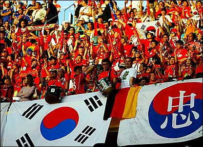 A cacophony of noise welcomes the Asian side onto the pitch as the South Korean fans get behind their side