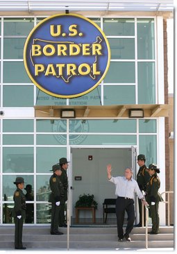 President George W. Bush waves from the new Yuma Border Patrol Station building Monday, April 9, 2007, during his visit to the Arizona border community to speak on immigration reform. The President told his audience, "We need to work together to come up with a practical solution to this problem, and I know people in Congress are working hard on this issue."  White House photo by Eric Draper