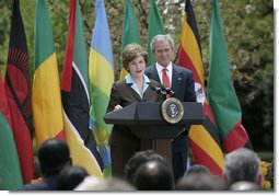 Mrs. Laura Bush is joined by President George W. Bush as she delivers remarks during a ceremony marking Malaria Awareness Day Wednesday, April 25, 2007, in the Rose Garden.  White House photo by Shealah Craighead