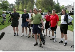 President George W. Bush stands with member of the President ' s Council on Physical Fitness and Sports as he addresses the press before a bike ride in Beltsville, Md., Saturday, May 5 , 2007. "Today I'm going to ride with a group of friends on a mountain bike," said the President in his remarks about May being Physical Fitness Month, "But the message to all Americans is to find time in your schedule to walk, run, swim, bike, to take care of yourselves." White House photo by Joyce Boghosian