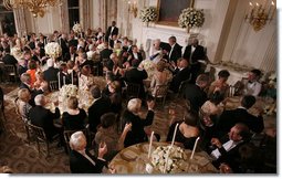 President George W. Bush and guests toasts Her Majesty Queen Elizabeth II of Great Britain following welcoming remarks Monday, May 7, 2007, during the State Dinner in her honor at the White House. White House photo by Eric Draper