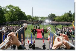 United States Army Band "Pershing's Own" Herald Trumpeters play from the South Portico Balcony Monday, May 7, 2007 during the state arrival ceremony for Her Majesty Queen Elizabeth of Britain and His Royal Highness the Prince Philip Duke of Edinburgh. Approximately 7000 guests attended the arrival ceremony held on the South Lawn of the White House.  White House photo by David Bohrer