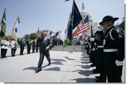 President George W. Bush salutes the color guard as he arrives at the annual Peace Officers Memorial Service outside the U.S. Capitol Tuesday, May 15, 2007, paying tribute to law enforcement officers who were killed in the line of duty during the previous year and their families. White House photo by Joyce Boghosian