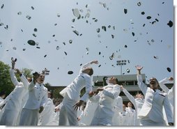 Following President George W. Bushs address to U.S. Coast Guard Academy graduates Wednesday, May 23, 2007, in New London, Conn., cadets toss their hats into the air. White House photo by Joyce Boghosian