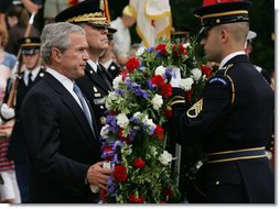 President George W. Bush is joined by Major General Guy Swan III, left, commander of the Military District of Washington, during the Memorial Day commemoration wreath laying ceremony at the Tomb of the Unknowns Monday, May 28, 2007, at Arlington National Cemetery in Arlington, VA. White House photo by Chris Greenberg