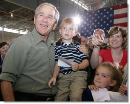 President George W. Bush poses for photos during his visit Wednesday, July 4, 2007, with members of the West Virginia Air National Guard 167th Airlift Wing and their family members in Martinsburg, W. Va. White House photo by Chris Greenberg