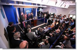 President George W. Bush and Mrs. Laura Bush participate in the ribbon-cutting ceremony to officially open the newly renovated James S. Brady Press Briefing Room Wednesday morning, July 11, 2007, at the White House.  White House photo by Eric Draper