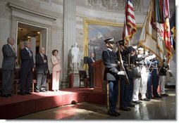 President George W. Bush stands with Dr. Norman Bourlag during the Congressional Gold Medal Ceremony honoring the doctor's efforts to combat hunger Tuesday, July 17 , 2007, at the U.S. Capitol. "Norman Borlaug's life has taken him from laboratories in America and Mexico to dusty villages throughout the developing world," said the President in his remarks. White House photo by Chris Greenberg