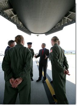 President George W. Bush meets with military personnel prior to boarding a C-17 aircraft to watch cargo loading operations Tuesday, July 24, 2007, during a visit to Charleston AFB in Charleston, S.C. White House photo by Eric Draper