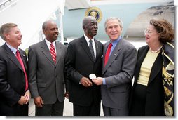 President George W. Bush presents the Congressional Gold Medal to Tuskegee Airman Earl Middleton Tuesday, July 24, 2007, joined by Middletons son, Kenny; South Carolina Senator Lindsey Graham, left, and Middleton family friend Joy Barnes, right, at the Charleston AFB in Charleston, S.C. White House photo by Eric Draper