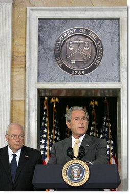 President George W. Bush stands with his economic advisors as he delivers a statement to the press Wednesday, Aug. 8, 2007, at the U.S. Department of Treasury in Washington, D.C. "We discussed our thriving economy and what we need to do to keep it that way," said President Bush. "We care a lot about whether our fellow citizens are working, and whether or not they've got money in their pockets to save, spend, or invest as they see fit." White House photo by Chris Greenberg