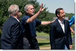 President George W. Bush waves to the press as he welcomes President Nicolas Sarkozy of France to Walkers Point Saturday, August 11, 2007, in Kennebunkport, Maine. White House photo by Shealah Craighead